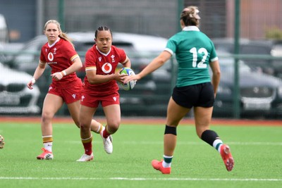 100526 - Wales U21 Women v Ireland U21 Women - Six Nations Women's U21 Series - Jenna De Vera of Wales Women is challenged by Lucia Linn Ireland Women