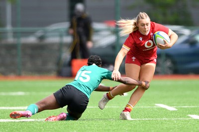 100526 - Wales U21 Women v Ireland U21 Women - Six Nations Women's U21 Series - Mabli Evans of Wales Women is challenged by Teni Onigbode of Ireland Women