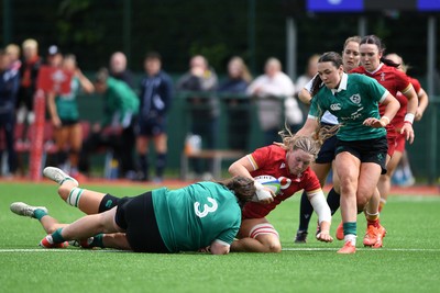 100526 - Wales U21 Women v Ireland U21 Women - Six Nations Women's U21 Series - Alaw Pyrs of Wales Women is challenged by Rosin Maher Ireland Women