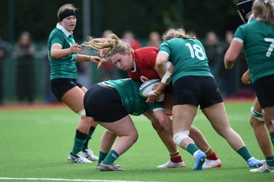 100526 - Wales U21 Women v Ireland U21 Women - Six Nations Women's U21 Series - Alaw Pyrs of Wales Women is challenged by Alisha Flynn Ireland Women
