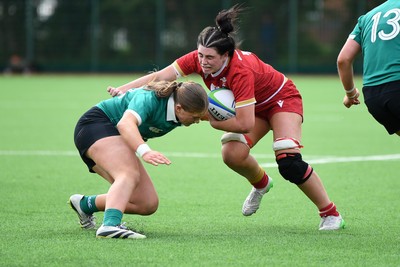 100526 - Wales U21 Women v Ireland U21 Women - Six Nations Women's U21 Series - Lucy Isaac of Wales Women is challenged by Niamh Murphy Ireland Women