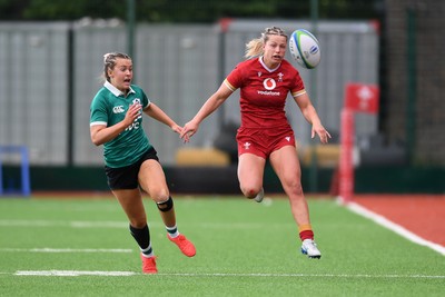 100526 - Wales U21 Women v Ireland U21 Women - Six Nations Women's U21 Series - Amy Williams of Wales Women is challenged by Katie Corrigan Ireland Women