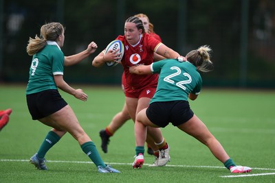 100526 - Wales U21 Women v Ireland U21 Women - Six Nations Women's U21 Series - Katherine Baverstock of Wales Women is challenged by Leah Irwin Ireland Women