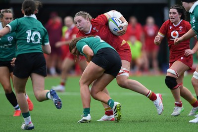100526 - Wales U21 Women v Ireland U21 Women - Six Nations Women's U21 Series - Alaw Pyrs of Wales Women is challenged by Leah Irwin Ireland Women