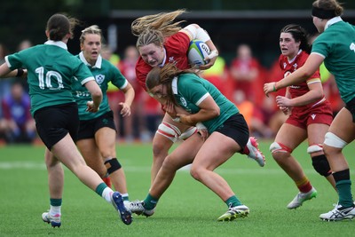 100526 - Wales U21 Women v Ireland U21 Women - Six Nations Women's U21 Series - Katherine Baverstock of Wales Women is challenged by Leah Irwin Ireland Women
