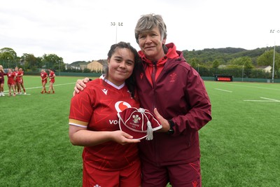 100526 - Wales U21 Women v Ireland U21 Women - Six Nations Women's U21 Series - Crystal James of Wales Women is presented a cap by Liza Burgess, Wales Women's Head Coach