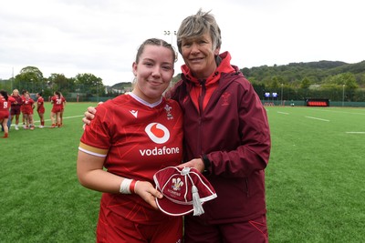 100526 - Wales U21 Women v Ireland U21 Women - Six Nations Women's U21 Series - Elan Jones of Wales Women is presented a cap by Liza Burgess, Wales Women's Head Coach