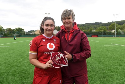 100526 - Wales U21 Women v Ireland U21 Women - Six Nations Women's U21 Series - Gwennan Hopkins of Wales Women is presented a cap by Liza Burgess, Wales Women's Head Coach