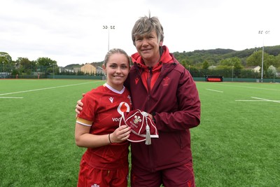 100526 - Wales U21 Women v Ireland U21 Women - Six Nations Women's U21 Series - Hanna Marshall of Wales Women is presented a cap by Liza Burgess, Wales Women's Head Coach