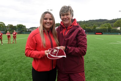 100526 - Wales U21 Women v Ireland U21 Women - Six Nations Women's U21 Series - Molly Wakley of Wales Women is presented a cap by Liza Burgess, Wales Women's Head Coach