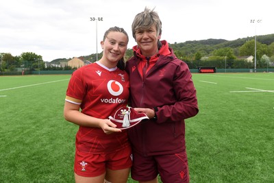 100526 - Wales U21 Women v Ireland U21 Women - Six Nations Women's U21 Series - Robyn Davies of Wales Women is presented a cap by Liza Burgess, Wales Women's Head Coach