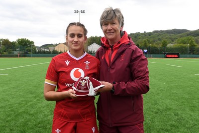 100526 - Wales U21 Women v Ireland U21 Women - Six Nations Women's U21 Series - Carys Hughes of Wales Women is presented a cap by Liza Burgess, Wales Women's Head Coach