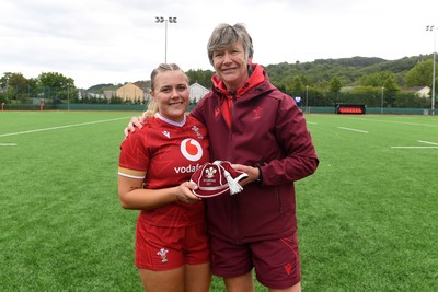 100526 - Wales U21 Women v Ireland U21 Women - Six Nations Women's U21 Series - Mabli Evans of Wales Women is presented a cap by Liza Burgess, Wales Women's Head Coach