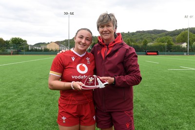 100526 - Wales U21 Women v Ireland U21 Women - Six Nations Women's U21 Series - Kendall Waudby of Wales Women is presented a cap by Liza Burgess, Wales Women's Head Coach