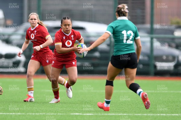 100526 - Wales U21 Women v Ireland U21 Women - Six Nations Women's U21 Series - Jenna De Vera of Wales Women is challenged by Lucia Linn Ireland Women