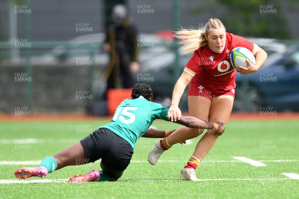 100526 - Wales U21 Women v Ireland U21 Women - Six Nations Women's U21 Series - Mabli Evans of Wales Women is challenged by Teni Onigbode of Ireland Women