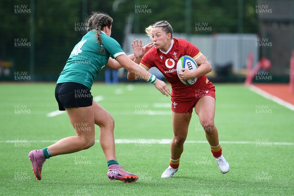 100526 - Wales U21 Women v Ireland U21 Women - Six Nations Women's U21 Series - Amy Williams of Wales Women is challenged by Katie Corrigan Ireland Women