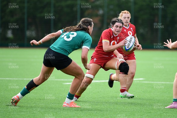 100526 - Wales U21 Women v Ireland U21 Women - Six Nations Women's U21 Series - Lucy Isaac of Wales Women is challenged by Niamh Murphy Ireland Women