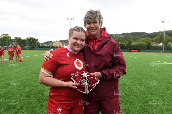 100526 - Wales U21 Women v Ireland U21 Women - Six Nations Women's U21 Series - Elizabeth Cook of Wales Women is presented a cap by Liza Burgess, Wales Women's Head Coach