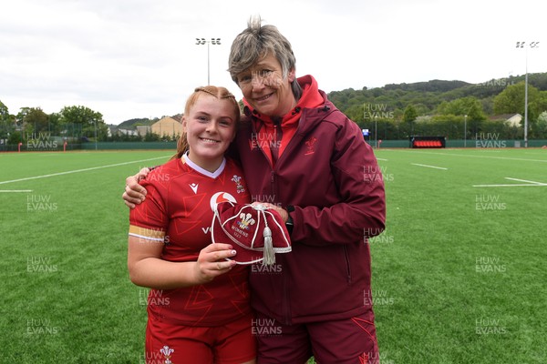 100526 - Wales U21 Women v Ireland U21 Women - Six Nations Women's U21 Series - Isla McMullen of Wales Women is presented a cap by Liza Burgess, Wales Women's Head Coach