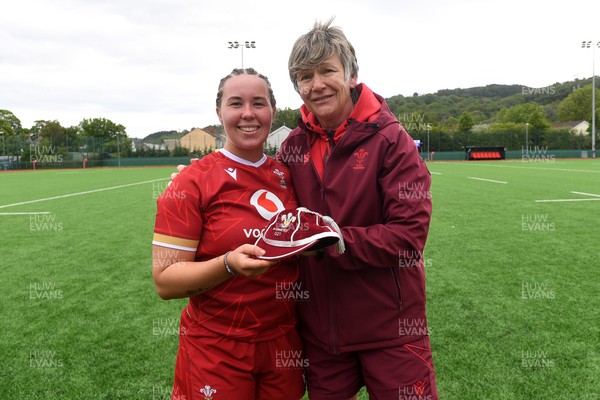 100526 - Wales U21 Women v Ireland U21 Women - Six Nations Women's U21 Series - Katherine Baverstock of Wales Women is presented a cap by Liza Burgess, Wales Women's Head Coach