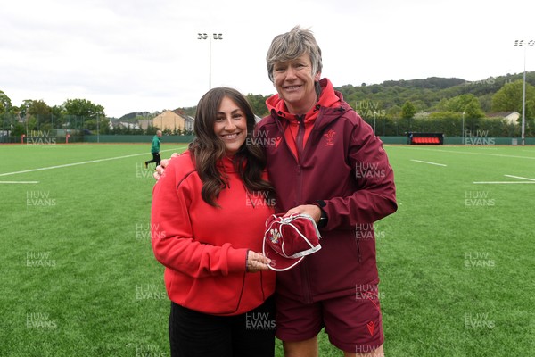 100526 - Wales U21 Women v Ireland U21 Women - Six Nations Women's U21 Series - Katie Bevans of Wales Women is presented a cap by Liza Burgess, Wales Women's Head Coach
