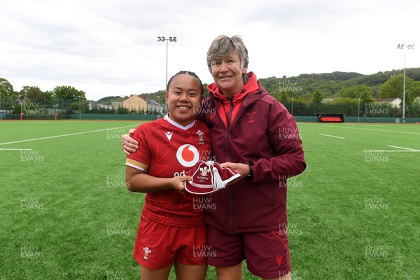 100526 - Wales U21 Women v Ireland U21 Women - Six Nations Women's U21 Series - Jenna De Vera of Wales Women is presented a cap by Liza Burgess, Wales Women's Head Coach