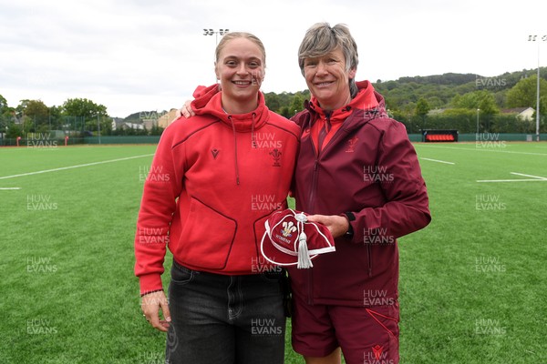 100526 - Wales U21 Women v Ireland U21 Women - Six Nations Women's U21 Series - Tilly Vucaj of Wales is presented a cap by Liza Burgess, Wales Women's Head Coach