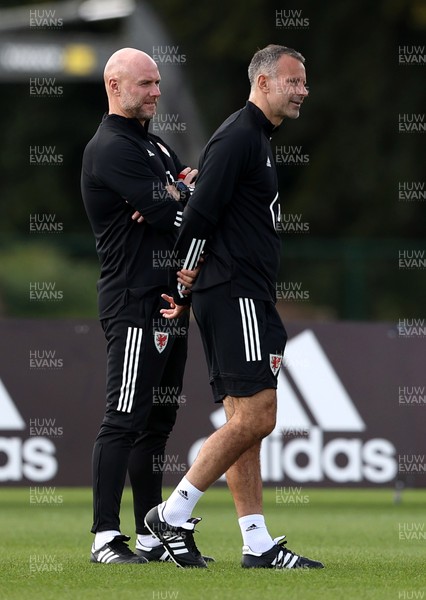 310820 - Wales U21s Football Training - Wales Manager Ryan Giggs watches U21s training with Robert Page