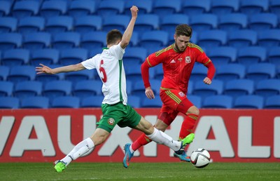 310315 -Wales U21s v Bulgaria U21s - UEFA U21 Championship Qualifier - Wes Burns of Wales is tackled by Kristiyan Malinov of Bulgaria
