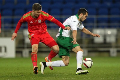 310315 -Wales U21s v Bulgaria U21s - UEFA U21 Championship Qualifier - Lee Evans of Wales tackles Georg Iliev of Bulgaria