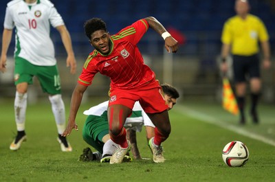 310315 -Wales U21s v Bulgaria U21s - UEFA U21 Championship Qualifier - Ellis Harrison of Wales is taken down by Hristo Popadyin of Bulgaria