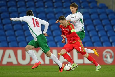 310315 -Wales U21s v Bulgaria U21s - UEFA U21 Championship Qualifier - Gethin Jones of Wales is challenged by Antonio Vutov of Bulgaria