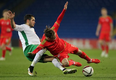 310315 -Wales U21s v Bulgaria U21s - UEFA U21 Championship Qualifier - Harry Wilson of Wales is brought down by Georg Iliev of Bulgaria