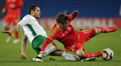 310315 -Wales U21s v Bulgaria U21s - UEFA U21 Championship Qualifier - Harry Wilson of Wales is brought down by Georg Iliev of Bulgaria