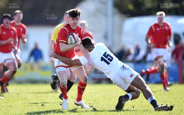 260317 - Wales Under 18 v England Under 18 - James McCarthy of Wales takes on Ben Loader