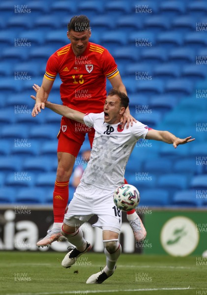 050621 - Wales v Albania - International Friendly - Kieffer Moore of Wales gets above Ardian Ismajli of Albania