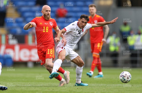 050621 - Wales v Albania - International Friendly - Jonny Williams of Wales is tackled by Qazim Laci of Albania