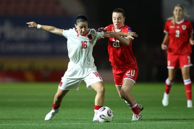 131026 - Wales Women v Albania Women - 2027 FIFA Womens World Cup qualifying play-off semi-final - Ilarja Zarka of Albania is challenged by Carrie Jones of Wales 