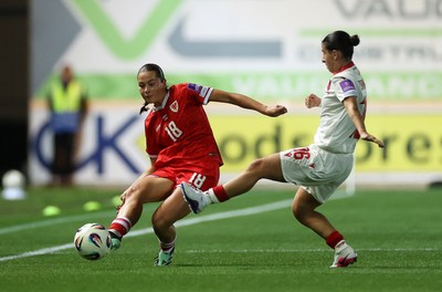 131026 - Wales Women v Albania Women - 2027 FIFA Womens World Cup qualifying play-off semi-final - Scarlett Hill of Wales is challenged by Ilarja Zarka of Albania 