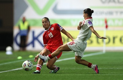 131026 - Wales Women v Albania Women - 2027 FIFA Womens World Cup qualifying play-off semi-final - Scarlett Hill of Wales is challenged by Ilarja Zarka of Albania 