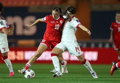 131026 - Wales Women v Albania Women - 2027 FIFA Womens World Cup qualifying play-off semi-final - Mared Griffiths of Wales is tackled by Ezmiralda Franja of Albania 