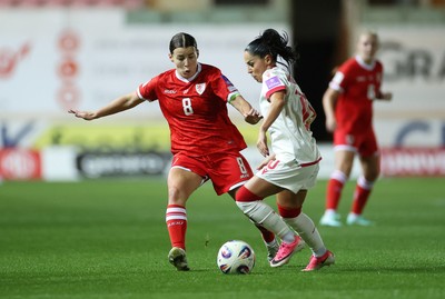 131026 - Wales Women v Albania Women - 2027 FIFA Womens World Cup qualifying play-off semi-final - Qendresa Krasniqi of Albania is challenged by Angharad James-Tunrer of Wales 