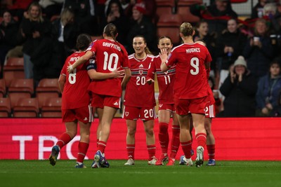 140426 - Wales v Albania - 2027 FIFA Women's World Cup Qualifying - Hannah Cain of Wales celebrates scoring her team’s first goal with teammates