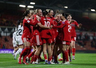 140426 - Wales v Albania - 2027 FIFA Women's World Cup Qualifying - Rhiannon Roberts of Wales celebrates scoring her team’s third goal with teammates