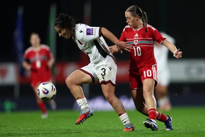 140426 - Wales v Albania - 2027 FIFA Women's World Cup Qualifying - Arbenita Curraj of Albania is challenged by Mared Griffiths of Wales