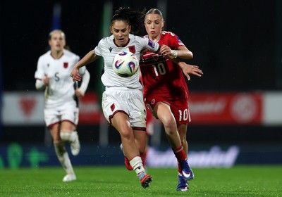 140426 - Wales v Albania - 2027 FIFA Women's World Cup Qualifying - Arbenita Curraj of Albania is challenged by Mared Griffiths of Wales