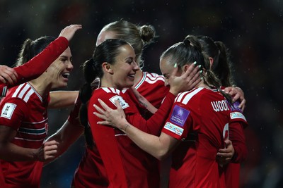 140426 - Wales v Albania - 2027 FIFA Women's World Cup Qualifying - Hannah Cain of Wales celebrates scoring her team’s fourth goal with teammate Lily Woodham