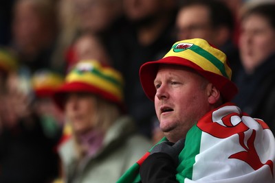 140426 - Wales v Albania - 2027 FIFA Women's World Cup Qualifying - A fan of Wales sings the national anthem