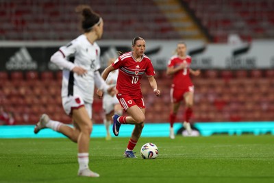 140426 - Wales v Albania - 2027 FIFA Women's World Cup Qualifying - Mared Griffiths of Wales runs with the ball